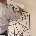 ShopSeif wallpaper being installed on wall