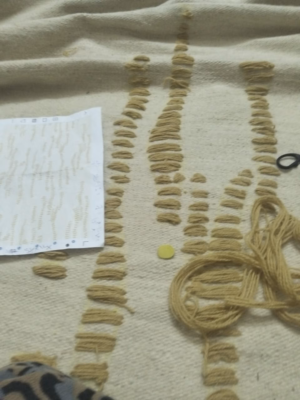 A detailed view of ShopSeif flatwoven rug being made